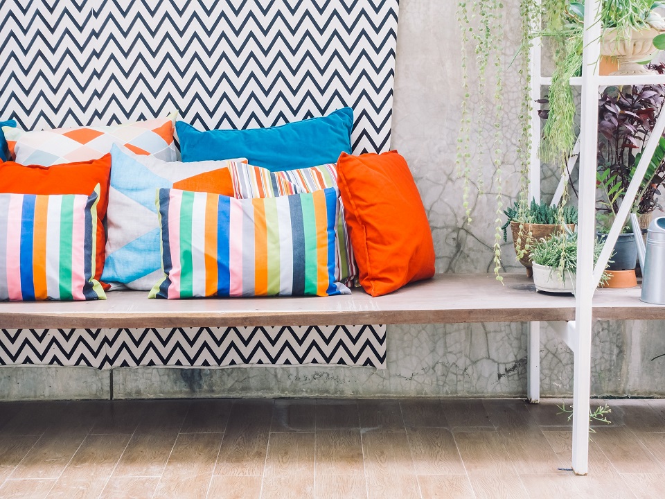 Patio outdoor deck with colorful pillow on chair decoration exterior of home - Vintage light filter
